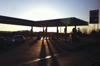 Cars on road at sunset