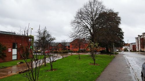 View of empty road against cloudy sky