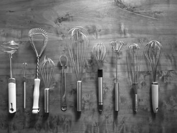 Various wire whisks on table