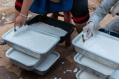 Low section of people working on white surface