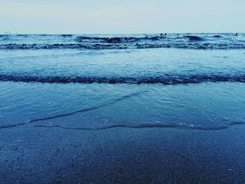 Scenic view of sea against blue sky