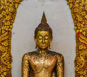 Close-up of statue against temple