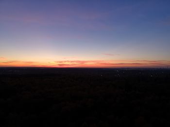 Scenic view of silhouette landscape against romantic sky at sunset
