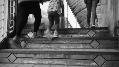 Low section of people standing on steps