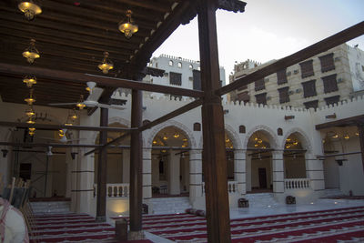 Low angle view of illuminated buildings against sky