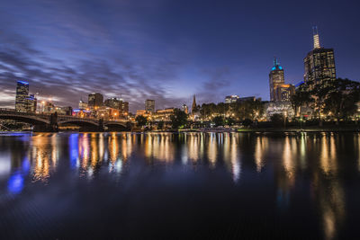 View of buildings lit up at night