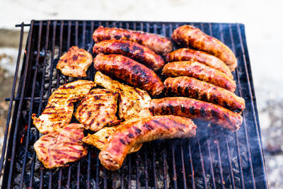 Close-up of meat on barbecue grill