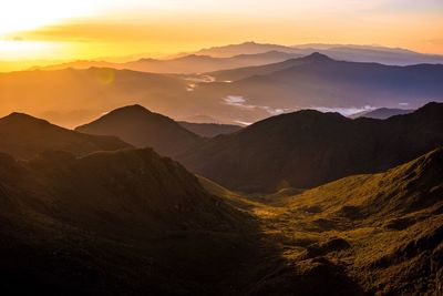 Scenic view of mountains against sky during sunset