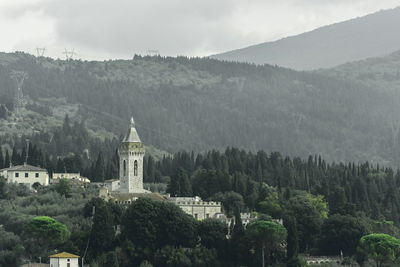 Panoramic view of trees and mountains against sky