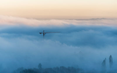 Silhouette against sky at sunset