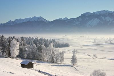 Scenic view of snow covered mountains