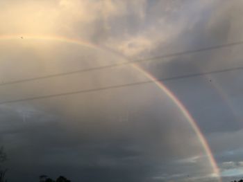 Low angle view of rainbow in sky