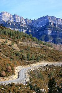 Scenic view of mountains against clear blue sky