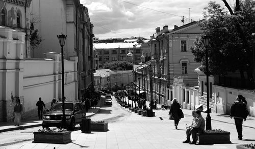 People walking on street in city