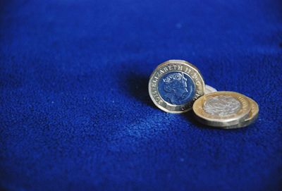 Close-up of coins on table