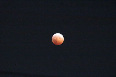 Low angle view of moon against sky at night