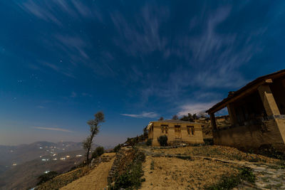 Low angle view of old building against sky at night