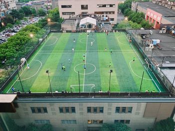 High angle view of soccer field in city