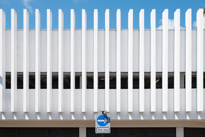 White building facade against blue sky