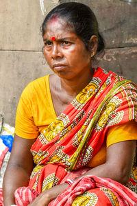 Portrait of woman sitting outdoors