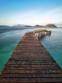 Pier over sea against sky