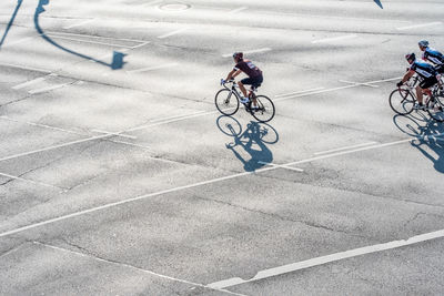 High angle view of man riding bicycle on street