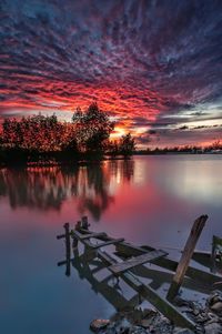 Scenic view of lake against sky during sunset