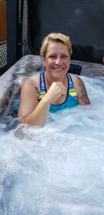 Portrait of smiling woman in swimming pool