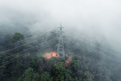 Scenic view of trees and mountains against sky