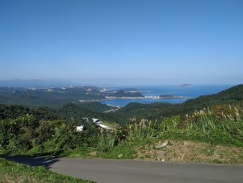 Scenic view of landscape against clear blue sky