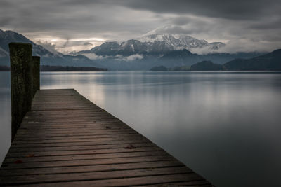 Pier over lake against sky