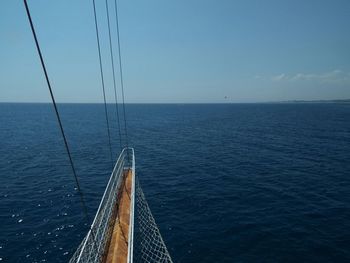 High angle view of cropped boat sailing on sea