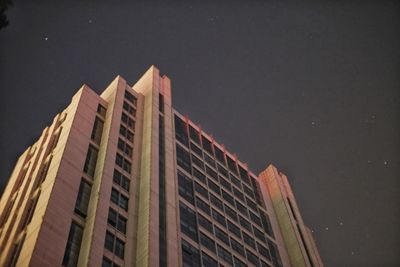 Low angle view of skyscraper against sky