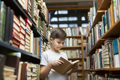 Full length of a woman reading book