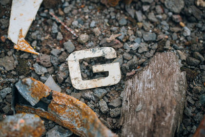 High angle view of text on rock