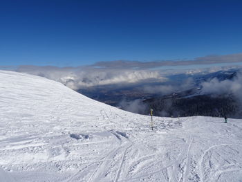 Scenic view of snow covered mountains