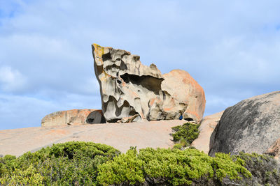 Low angle view of rock formations against sky