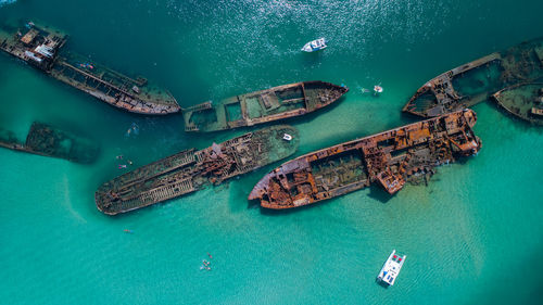 Aerial view of abandoned ships in sea