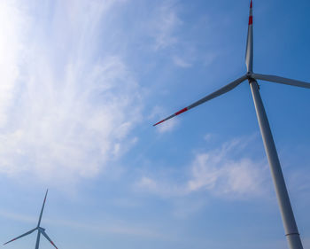 Low angle view of wind turbine against sky