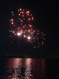 Firework display at night