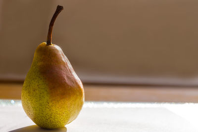 Close-up of pear on table