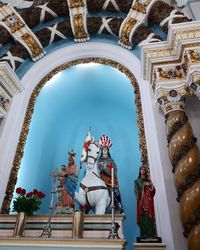 Low angle view of statues against building