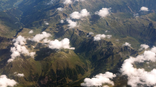 High angle view of land and mountains against sky