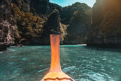 Scenic view of sea against rock formation