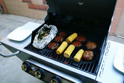 High angle view of meat on barbecue grill