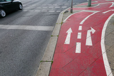 High angle view of arrow sign on road