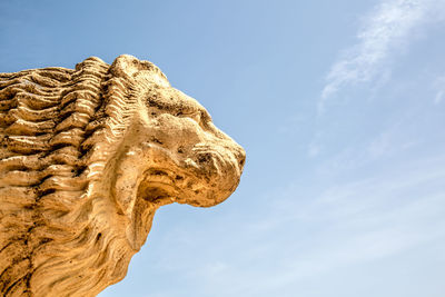 Low angle view of statue against sky