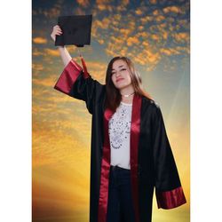 Smiling young woman standing against the sky