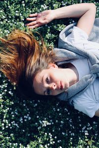 Portrait of woman lying down on plant