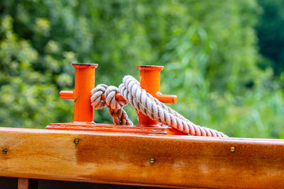 Close-up of machine part on railing